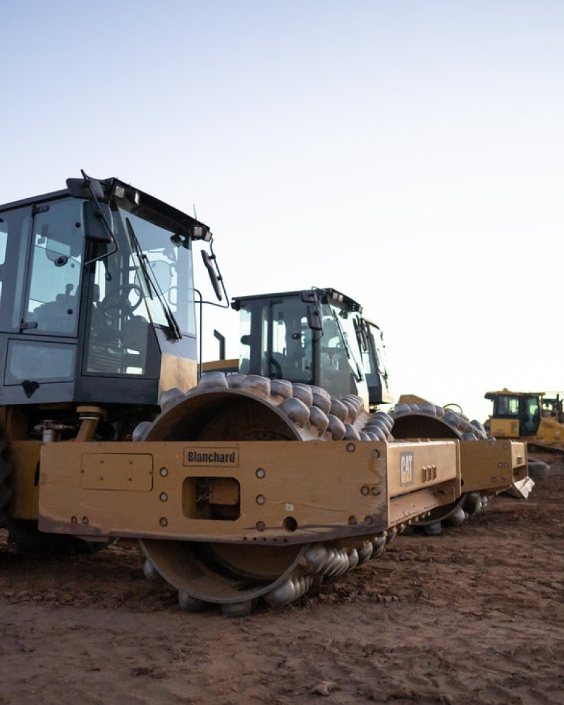 photo of a grading machinery on work site